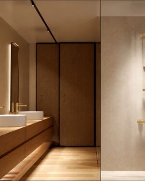 Casa de banho moderna com rampa de duche monocomando Série Toscana em Ouro Escovado instalada em ambiente elegante.
